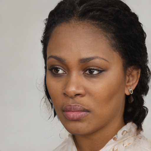 Neutral black young-adult female with medium  black hair and brown eyes