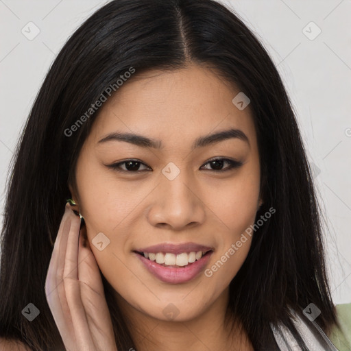 Joyful asian young-adult female with long  brown hair and brown eyes