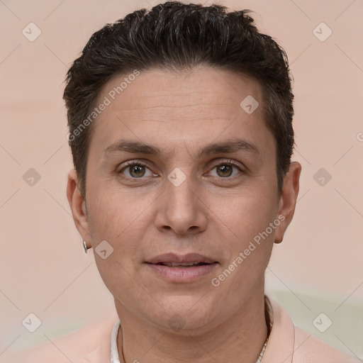 Joyful white adult male with short  brown hair and brown eyes