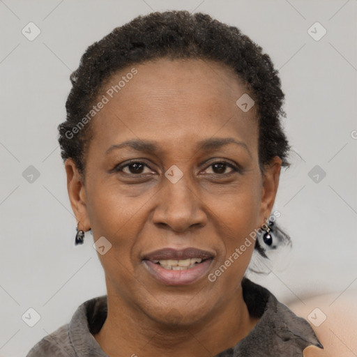 Joyful black adult female with short  brown hair and brown eyes