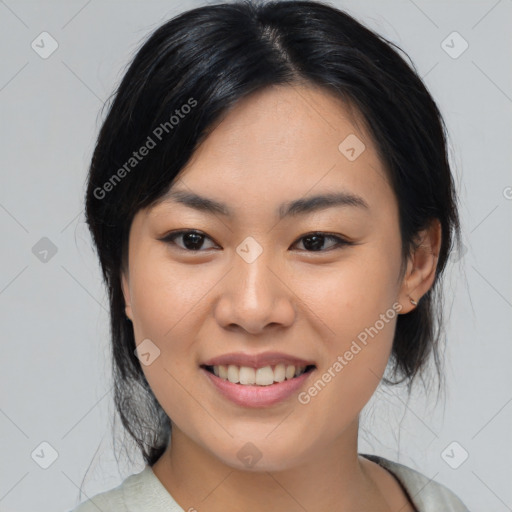 Joyful asian young-adult female with medium  black hair and brown eyes