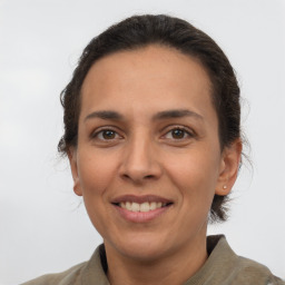 Joyful white adult female with short  brown hair and brown eyes