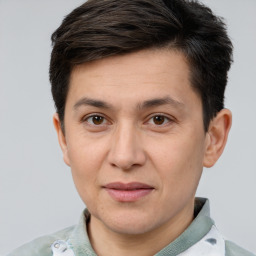 Joyful white adult male with short  brown hair and brown eyes