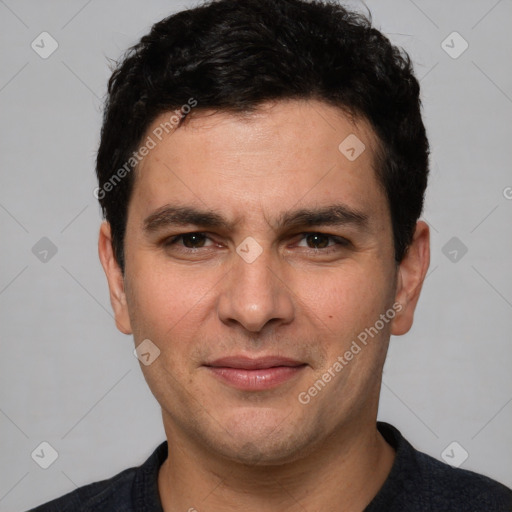 Joyful white young-adult male with short  black hair and brown eyes