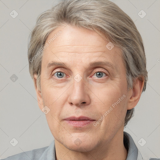 Joyful white middle-aged male with short  brown hair and grey eyes