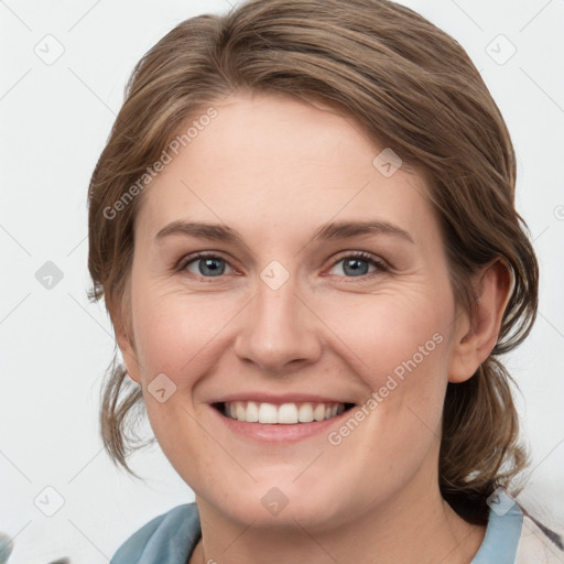 Joyful white young-adult female with medium  brown hair and blue eyes