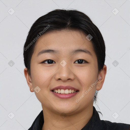 Joyful asian young-adult female with short  black hair and brown eyes