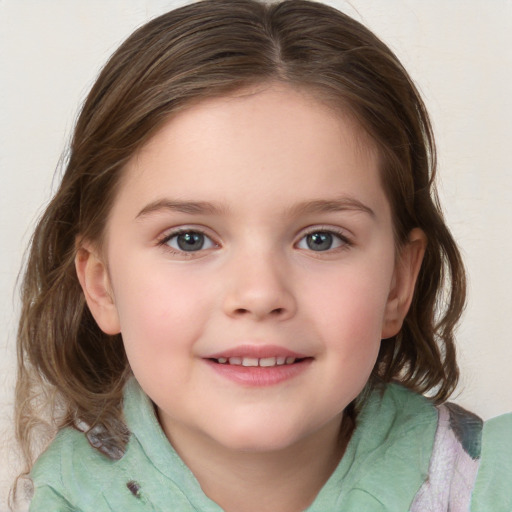 Joyful white child female with medium  brown hair and grey eyes