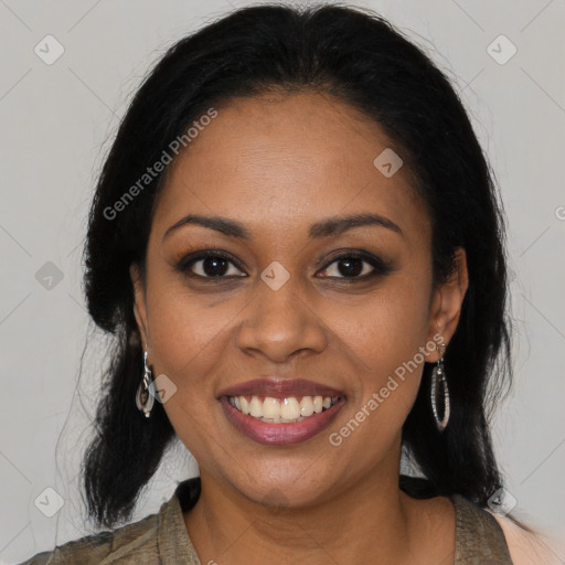 Joyful black young-adult female with long  brown hair and brown eyes