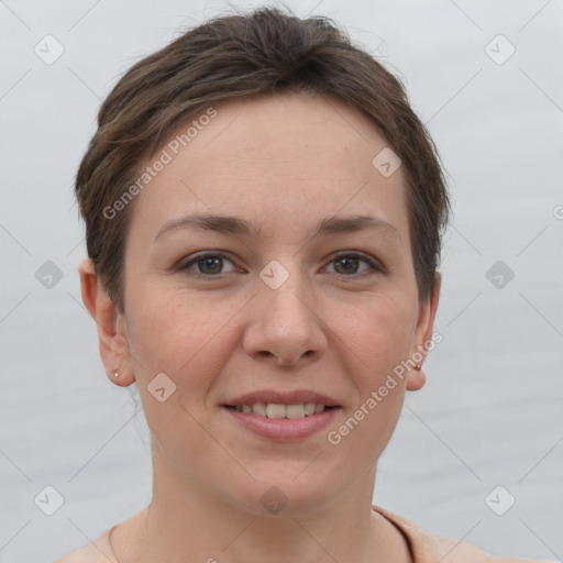 Joyful white young-adult female with short  brown hair and brown eyes