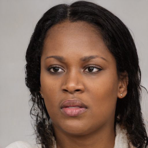 Neutral black young-adult female with long  black hair and brown eyes