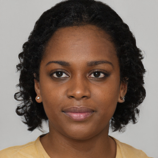 Neutral black young-adult female with medium  black hair and brown eyes