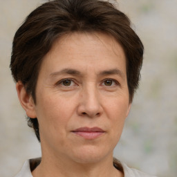 Joyful white adult female with short  brown hair and brown eyes