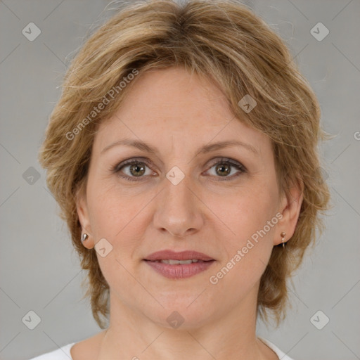 Joyful white adult female with medium  brown hair and brown eyes