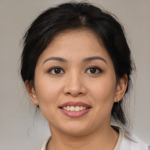 Joyful white young-adult female with medium  brown hair and brown eyes