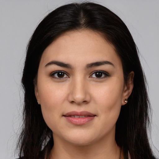 Joyful white young-adult female with long  brown hair and brown eyes