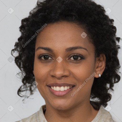 Joyful black young-adult female with medium  brown hair and brown eyes