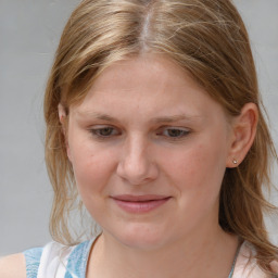 Joyful white young-adult female with medium  brown hair and blue eyes