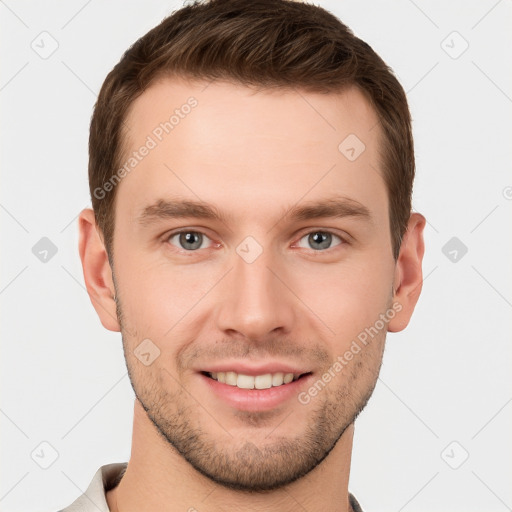 Joyful white young-adult male with short  brown hair and grey eyes