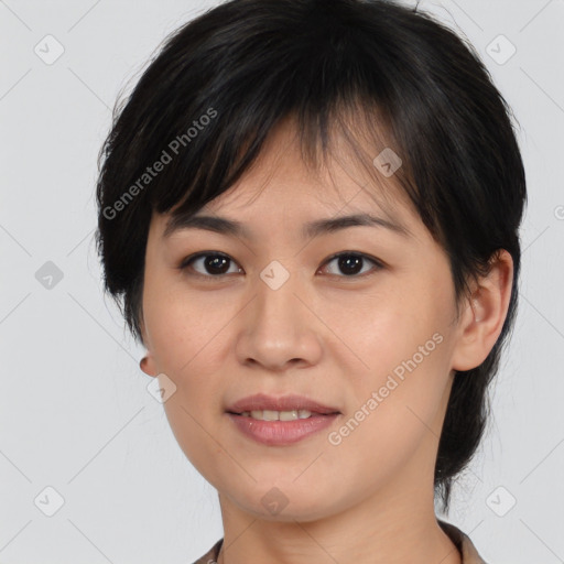 Joyful asian young-adult female with medium  brown hair and brown eyes