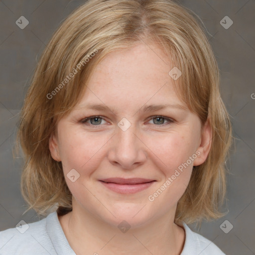 Joyful white young-adult female with medium  brown hair and blue eyes