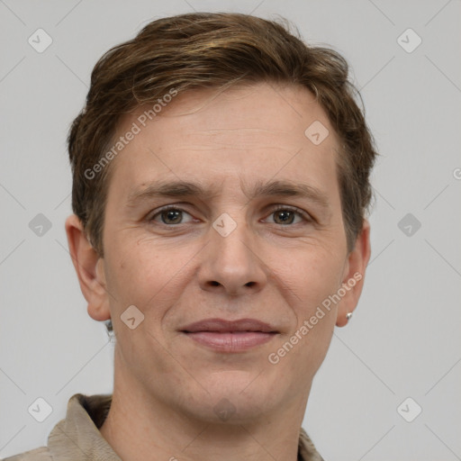 Joyful white adult male with short  brown hair and grey eyes