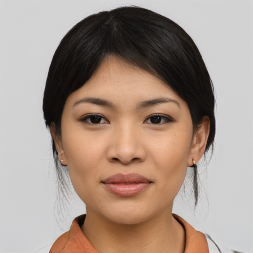 Joyful asian young-adult female with medium  black hair and brown eyes