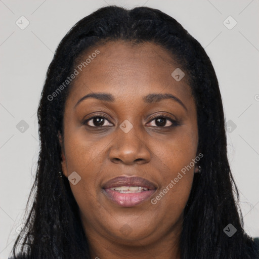 Joyful black young-adult female with long  black hair and brown eyes