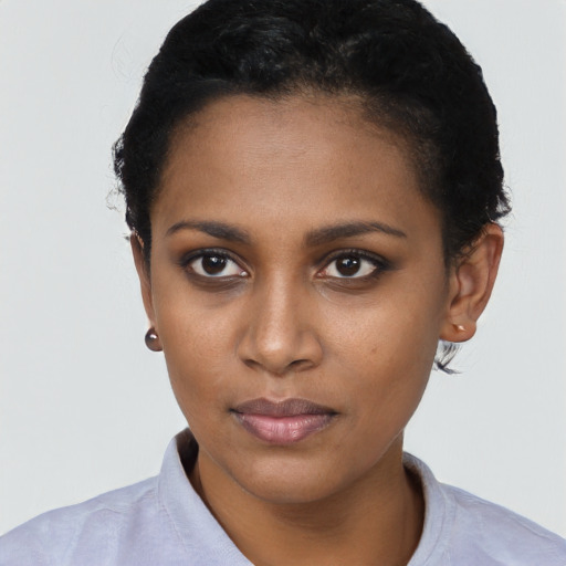 Neutral black young-adult female with short  black hair and brown eyes