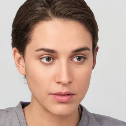 Neutral white young-adult female with short  brown hair and brown eyes