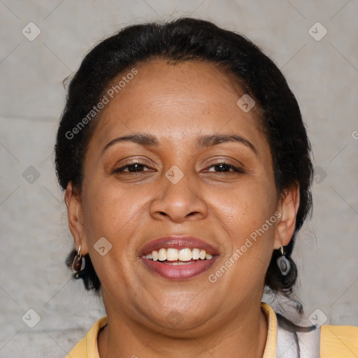 Joyful latino adult female with medium  brown hair and brown eyes