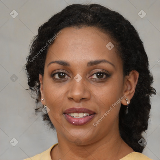 Joyful black adult female with medium  brown hair and brown eyes