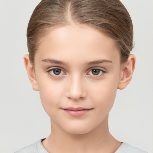 Joyful white child female with short  brown hair and brown eyes