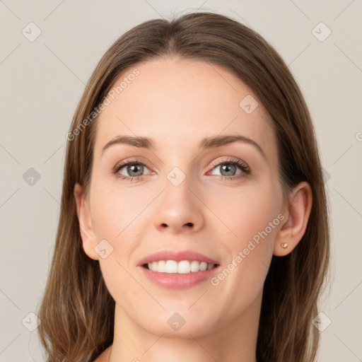 Joyful white young-adult female with long  brown hair and grey eyes