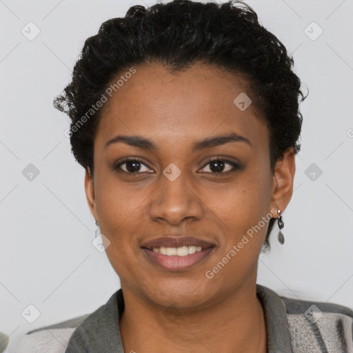 Joyful black young-adult female with short  black hair and brown eyes