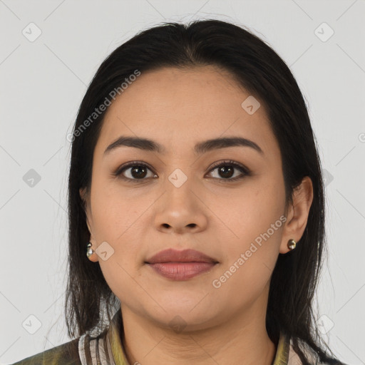 Joyful latino young-adult female with medium  brown hair and brown eyes