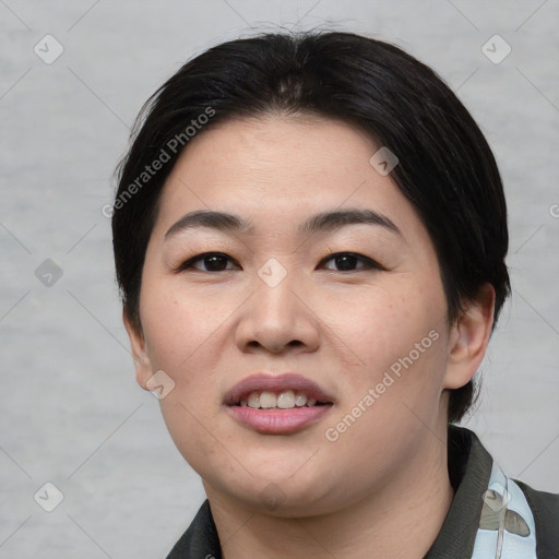 Joyful asian young-adult female with short  black hair and brown eyes