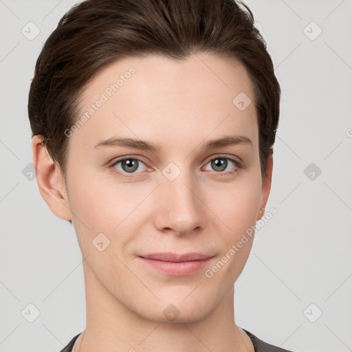 Joyful white young-adult female with short  brown hair and grey eyes