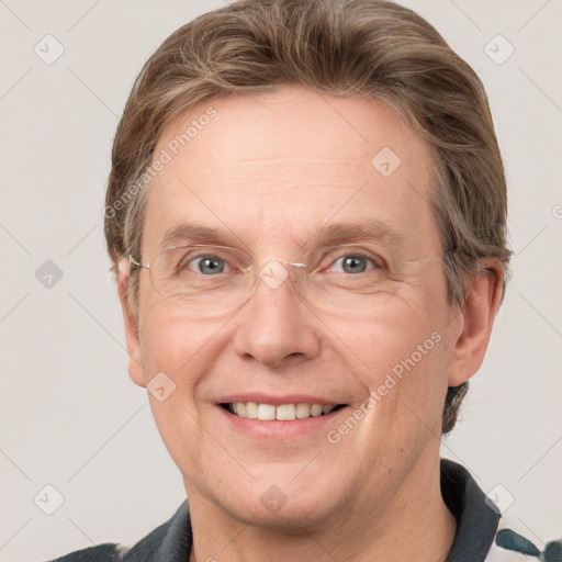 Joyful white adult male with short  brown hair and grey eyes