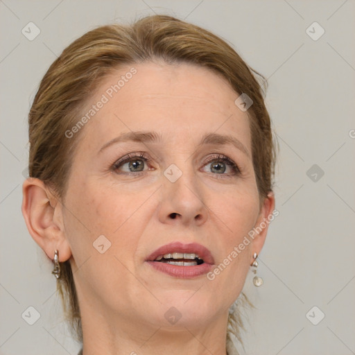 Joyful white adult female with medium  brown hair and grey eyes