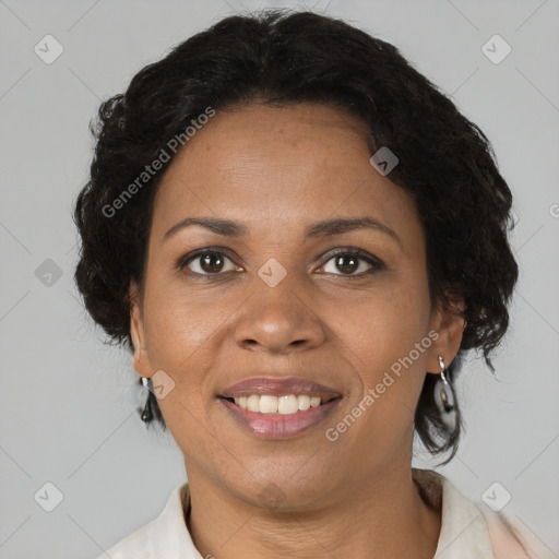 Joyful black adult female with short  brown hair and brown eyes