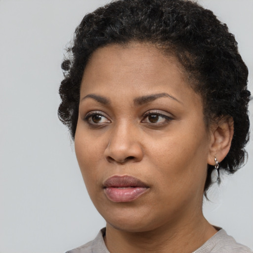 Neutral black young-adult female with short  black hair and brown eyes