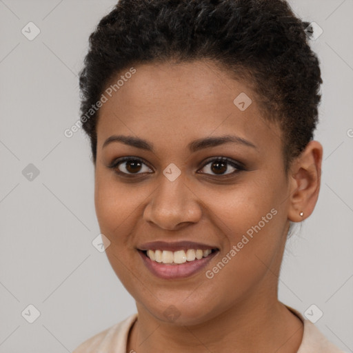 Joyful black young-adult female with short  brown hair and brown eyes