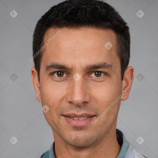 Joyful white adult male with short  brown hair and brown eyes