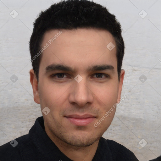 Joyful white young-adult male with short  black hair and brown eyes