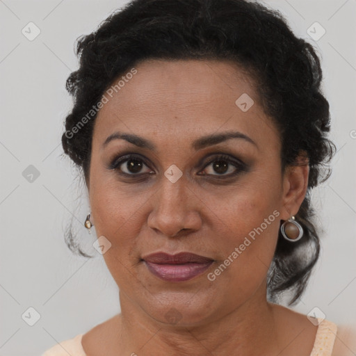 Joyful latino adult female with short  brown hair and brown eyes