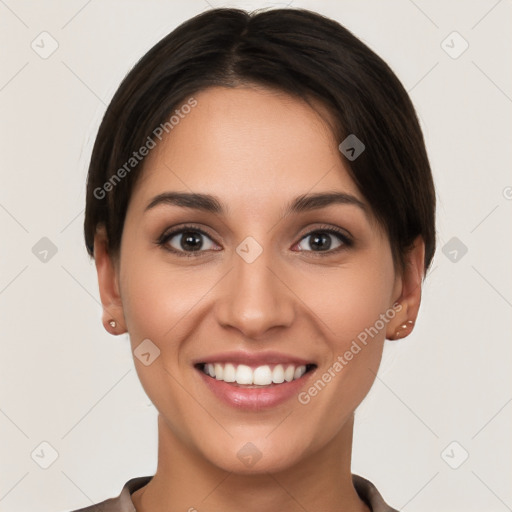 Joyful white young-adult female with short  brown hair and brown eyes