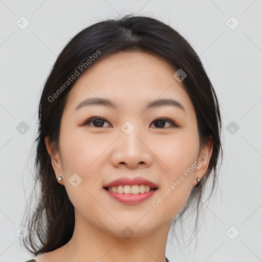 Joyful asian young-adult female with medium  black hair and brown eyes