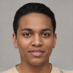 Joyful latino young-adult male with short  black hair and brown eyes