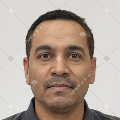 Neutral latino adult male with short  black hair and brown eyes